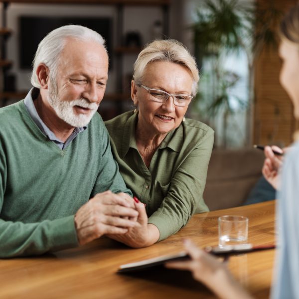 Older couple going over options for their planned giving to pass on their inheritance to a good cause.
